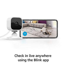 Load image into Gallery viewer, Blink Mini – Compact indoor plug-in smart security camera, 1080p HD video, night vision, motion detection, two-way audio, easy set up, Works with Alexa – 2 cameras (White)
