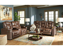 Load image into Gallery viewer, Signature Design by Ashley Owner&#39;s Box Faux Leather Power Reclining Sofa with Adjustable Headrest, Brown
