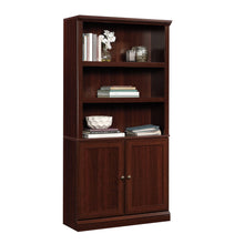 Load image into Gallery viewer, Sauder Miscellaneous Storage Bookcase With Doors/ book shelf, Select Cherry finish
